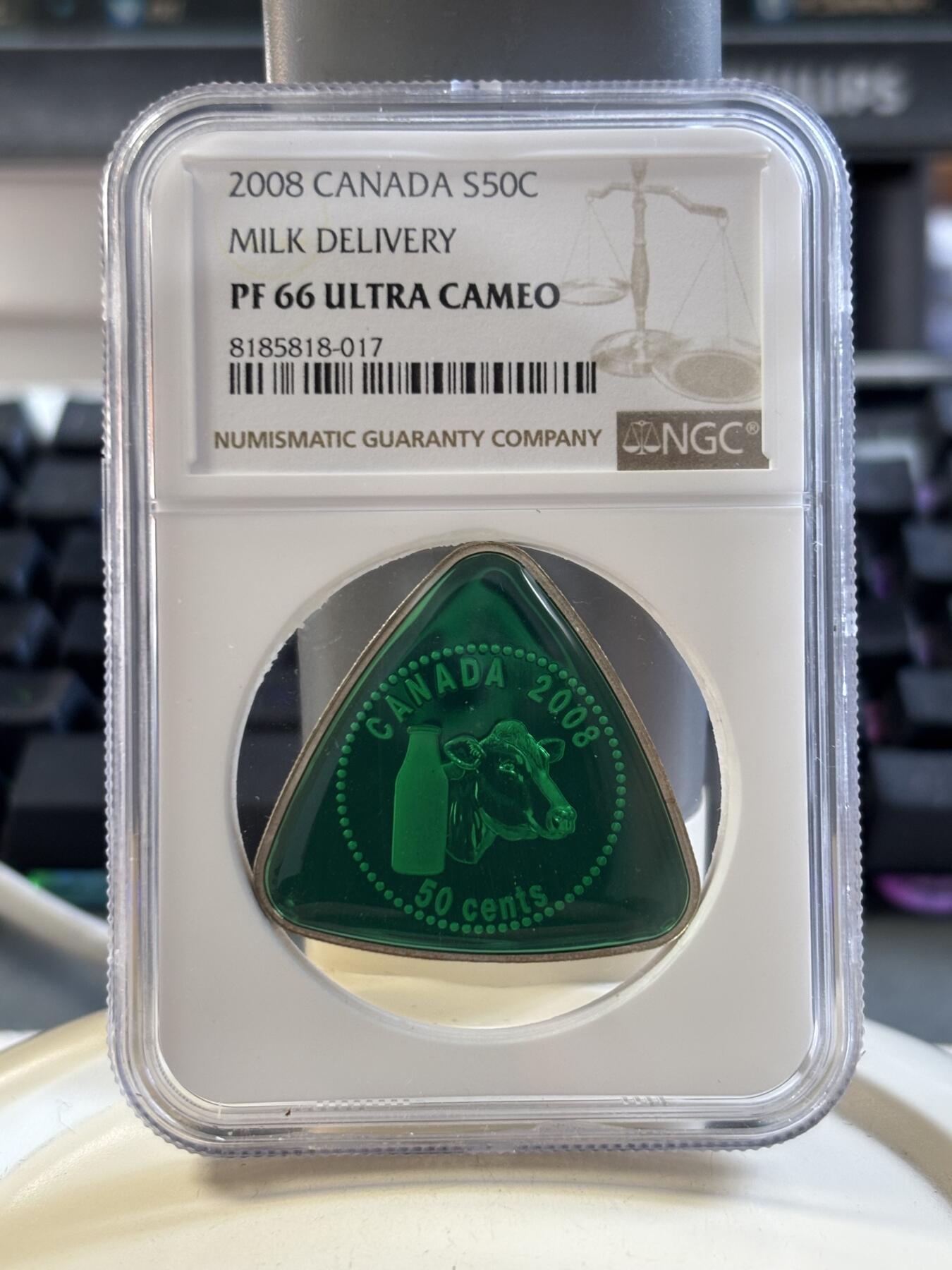 第186期拍卖 加拿大2008年牛奶支付代用币精制三角形纪念银币，20克