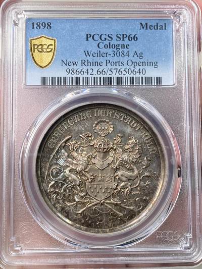 万国钱币拍卖第058期（万国新年大拍） - PCGS SP66 1898年德国圣城科隆新港口开放典礼纪念大银章 欧洲紫罗兰渐变彩虹色包浆 科隆城市纹章在币章中出现不多 此枚将圣城狮鹫+雄狮盾徽完美具象化 非常难得和少见 镜面五彩高浮雕GEM典藏级 PC唯一冠军分 40MM 22G