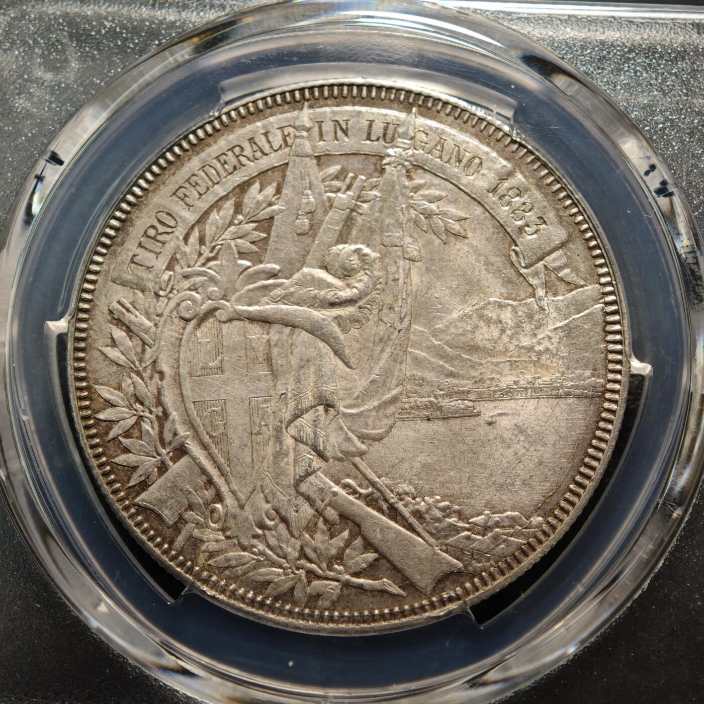 【德藏】世界币章拍卖第159期(元旦专场拍卖) 1883年 瑞士提契诺州卢加诺联邦射击节5法郎纪念银币 PCGS MS62 原味包浆 品相极佳