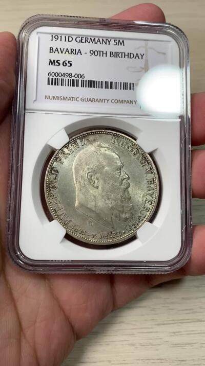万国钱币拍卖第058期（万国新年大拍） NGC MS65 1911巴伐利亚利奥波德九十大寿纪念5马克 原味五彩BU转光 无可挑剔的品质状态
