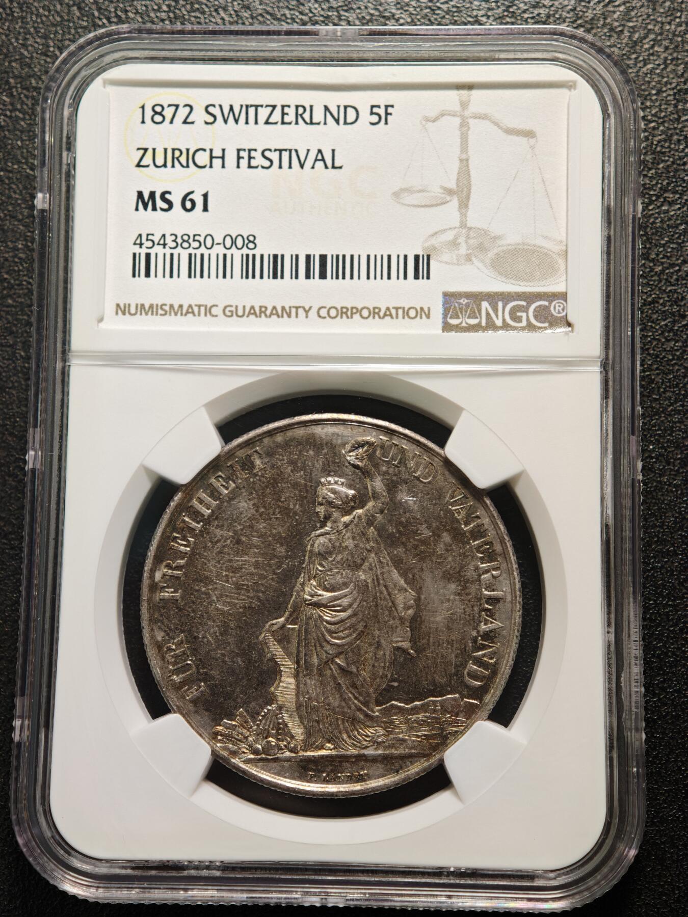 【德藏】世界币章拍卖第159期(元旦专场拍卖) 1872年 瑞士苏黎世射击节5法郎大银币，发行量仅1万枚 NGC MS61 正面是瑞士自由女神一手高举桂冠、一手扶着盾牌的站立像，背面是瑞士盾牌和射击节徽章，雕刻精美，保存状态良好，五彩包浆，稀少品种，NGC低评