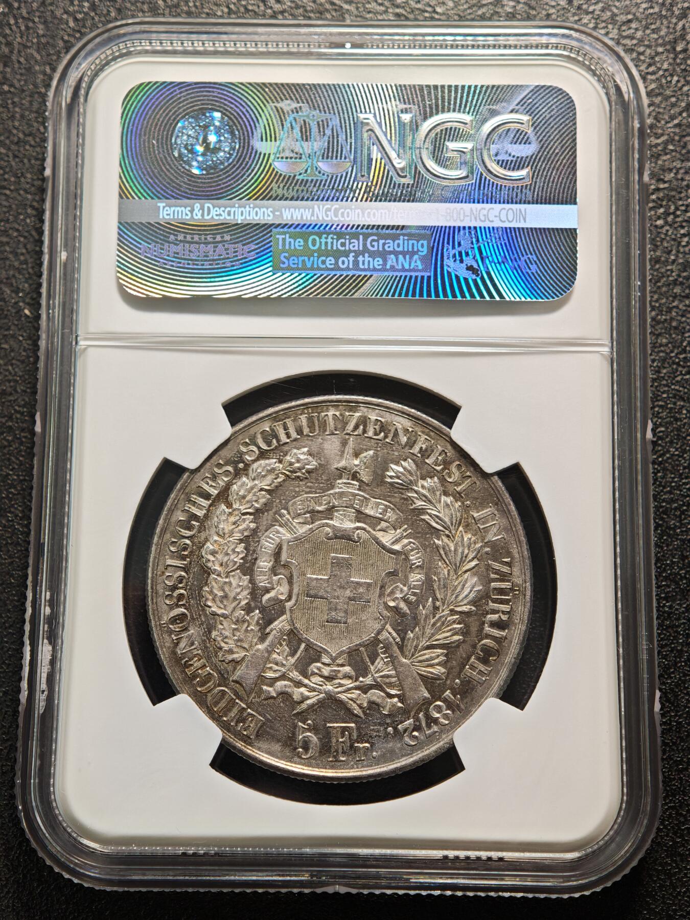 【德藏】世界币章拍卖第159期(元旦专场拍卖) 1872年 瑞士苏黎世射击节5法郎大银币，发行量仅1万枚 NGC MS61 正面是瑞士自由女神一手高举桂冠、一手扶着盾牌的站立像，背面是瑞士盾牌和射击节徽章，雕刻精美，保存状态良好，五彩包浆，稀少品种，NGC低评