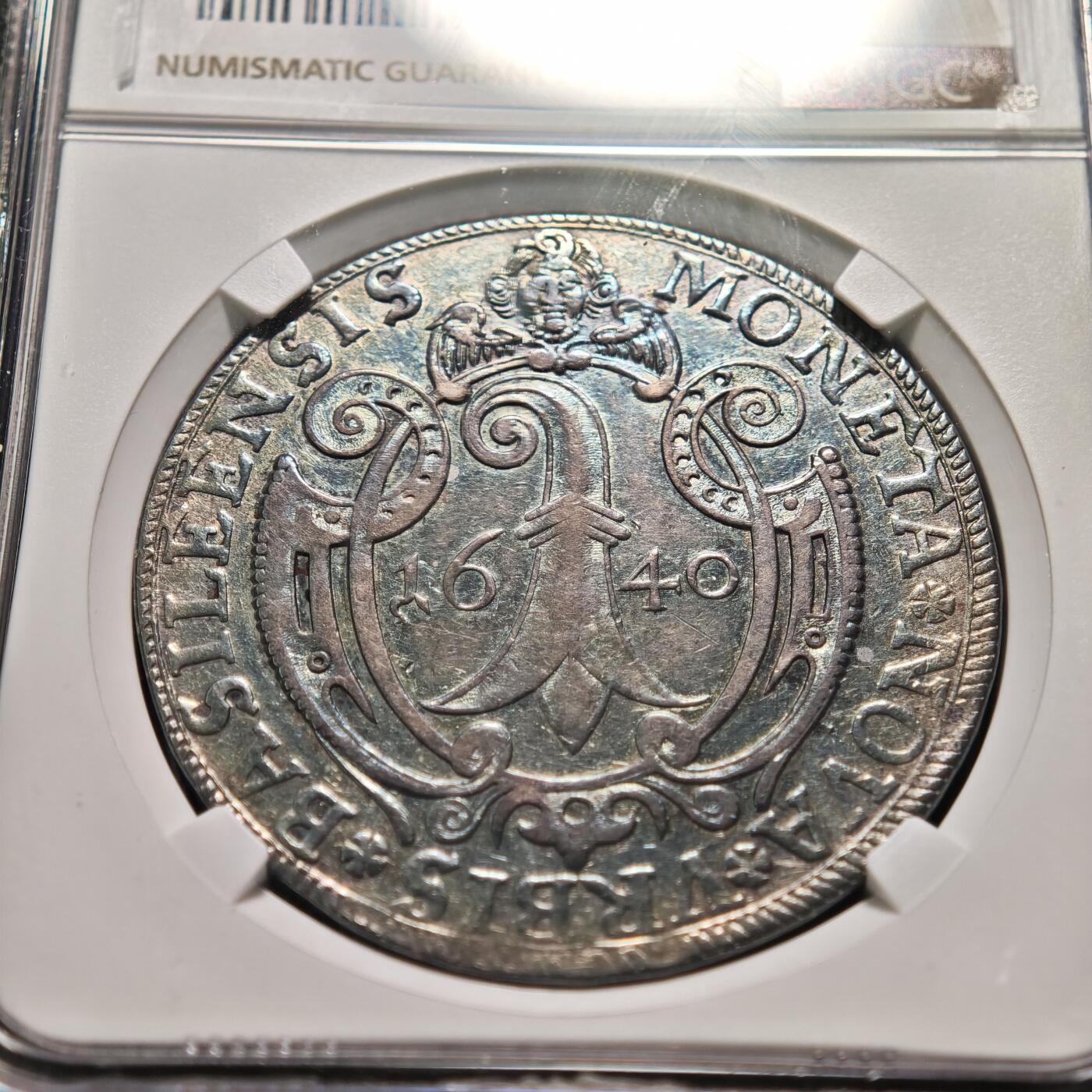 【德藏】世界币章拍卖第159期(元旦专场拍卖) 1640年 瑞士巴塞尔西里西亚布雷斯劳泰勒大银币 NGC AU53 深彩包浆 西里西亚布雷斯劳市，西里西亚是神圣罗马帝国的重要邦领，布雷斯劳是其核心城市；1640年正值三十年战争（1618-1648） 末期，欧洲局势动荡，该银币是战时西里西亚的流通与储藏货币