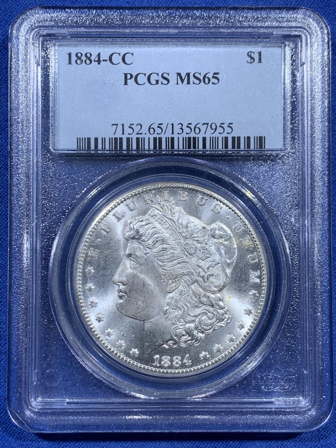 《竞宝斋》第452场 周日，周一 2场连拍 （全场包邮，欢迎送拍） PCGS MS65 美国 1884 CC 摩根 银币 卡森厂 高分难得 十字转光 早期盒装保存这么好更显不易 细节见图