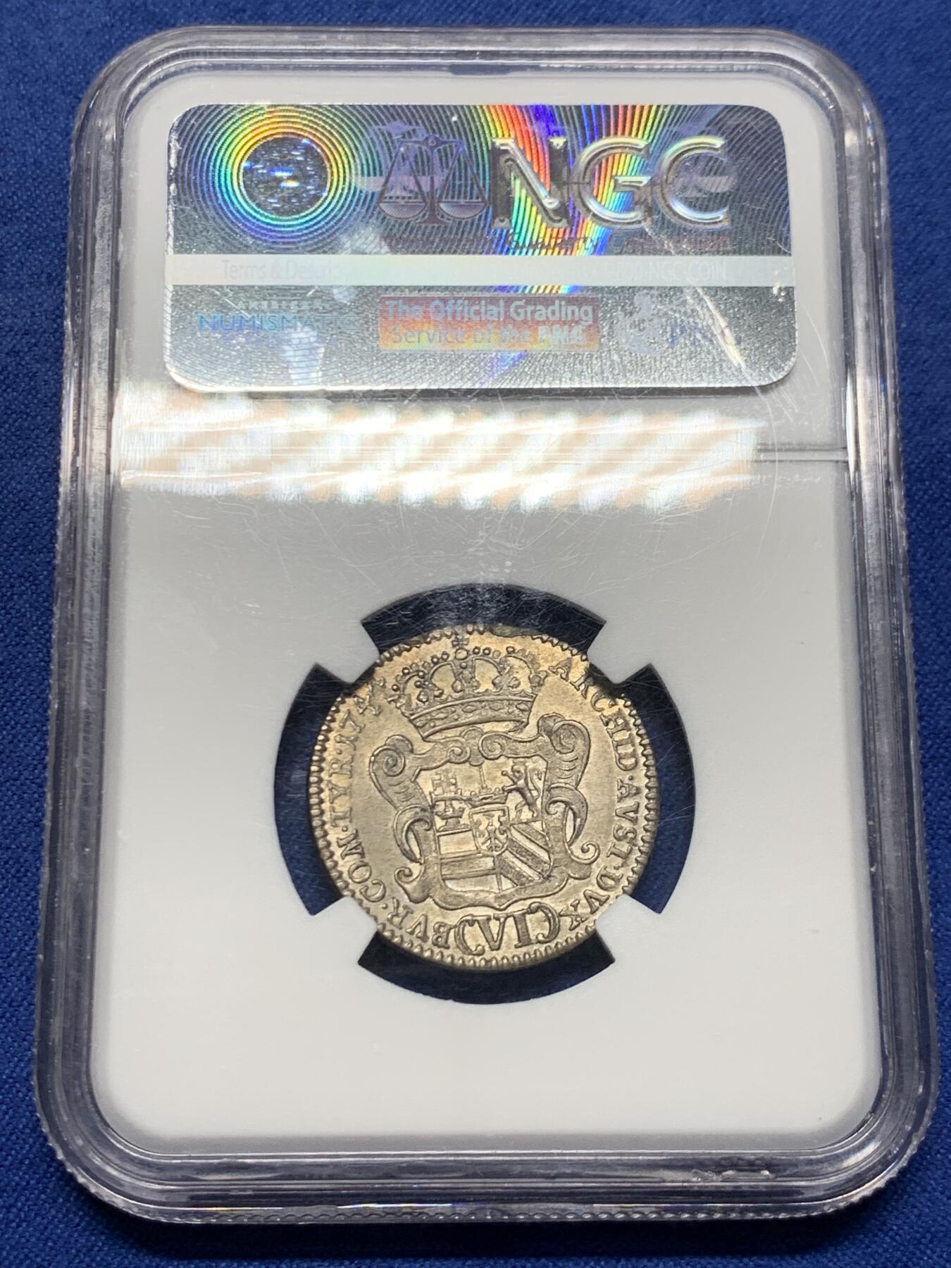 《竞宝斋》第452场 周日，周一 2场连拍 （全场包邮，欢迎送拍） NGC MS61 玛丽亚特蕾莎年轻版1744年6克鲁泽银币 大奶妈刚继承奥地利但还不是皇后的版 奥地利王位继承战争期间 所以没有帝国双头鹰只有自家领地盾(波希米亚匈牙利奥地利勃艮第) 半机制币难得的MS! 奥地利蒂罗尔的哈尔厂生产(中心盾是鹰) 滚筒造币机细节盾徽清清楚楚的压印 完整漂亮的原光淡黄包浆