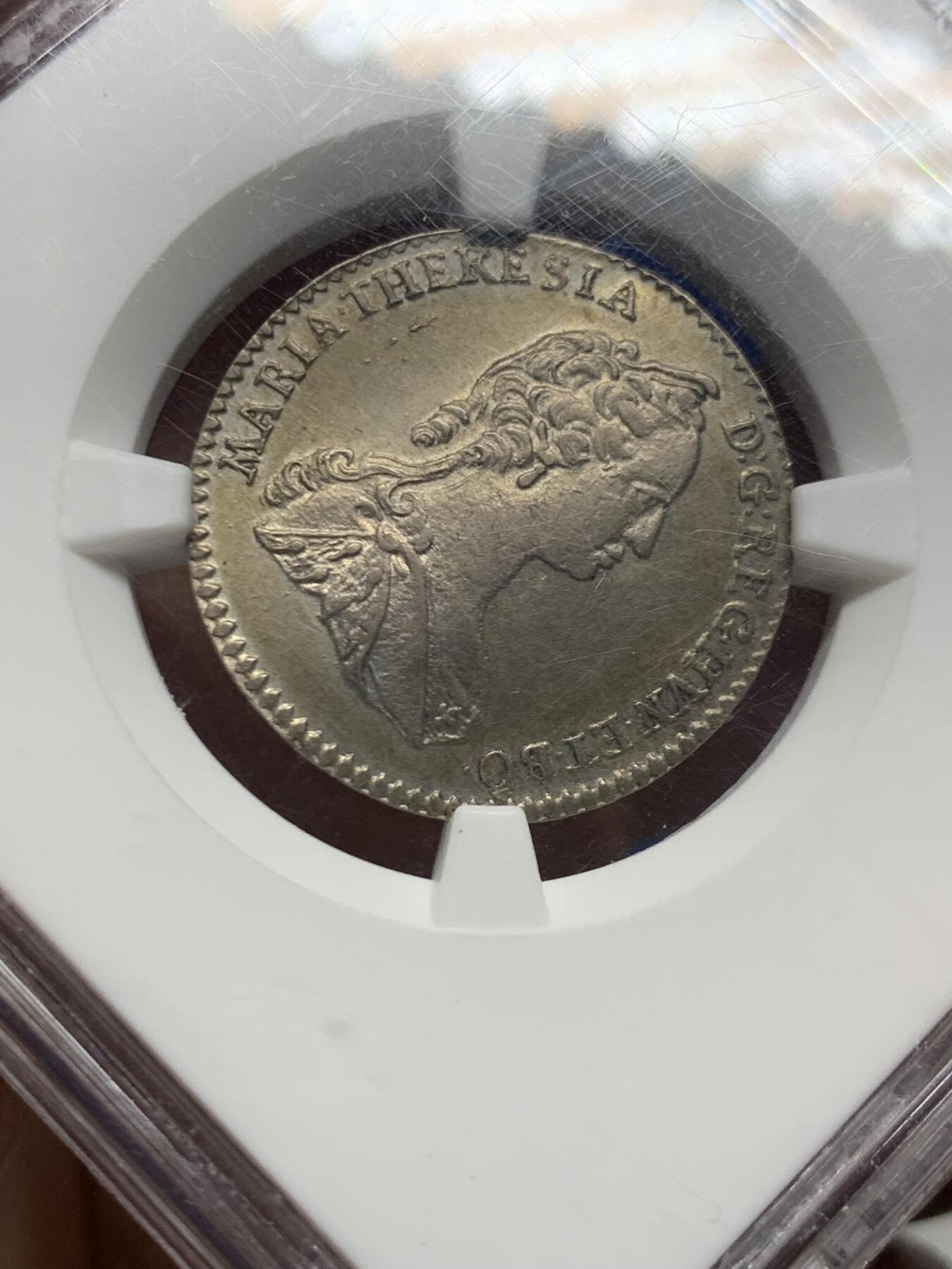 《竞宝斋》第452场 周日，周一 2场连拍 （全场包邮，欢迎送拍） NGC MS61 玛丽亚特蕾莎年轻版1744年6克鲁泽银币 大奶妈刚继承奥地利但还不是皇后的版 奥地利王位继承战争期间 所以没有帝国双头鹰只有自家领地盾(波希米亚匈牙利奥地利勃艮第) 半机制币难得的MS! 奥地利蒂罗尔的哈尔厂生产(中心盾是鹰) 滚筒造币机细节盾徽清清楚楚的压印 完整漂亮的原光淡黄包浆