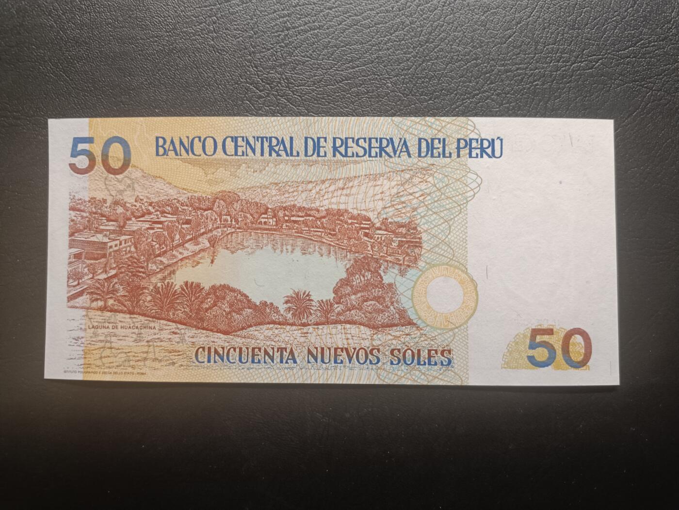 2026首期，总第211期 秘鲁1994年50新索尔UNC微潮狮子身0000无47，稀有早期年份中高面值，作家品托和瓦卡奇纳湖