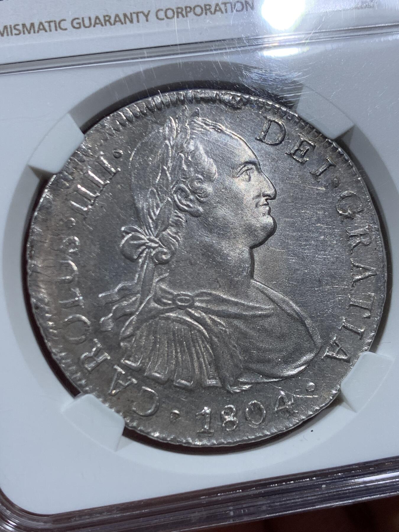 《竞宝斋》第452场 周日，周一 2场连拍 （全场包邮，欢迎送拍） NGC MS62 西属墨西哥1804年卡洛斯四世8里亚尔银币，人像状态非常好，底板略带PL质感。