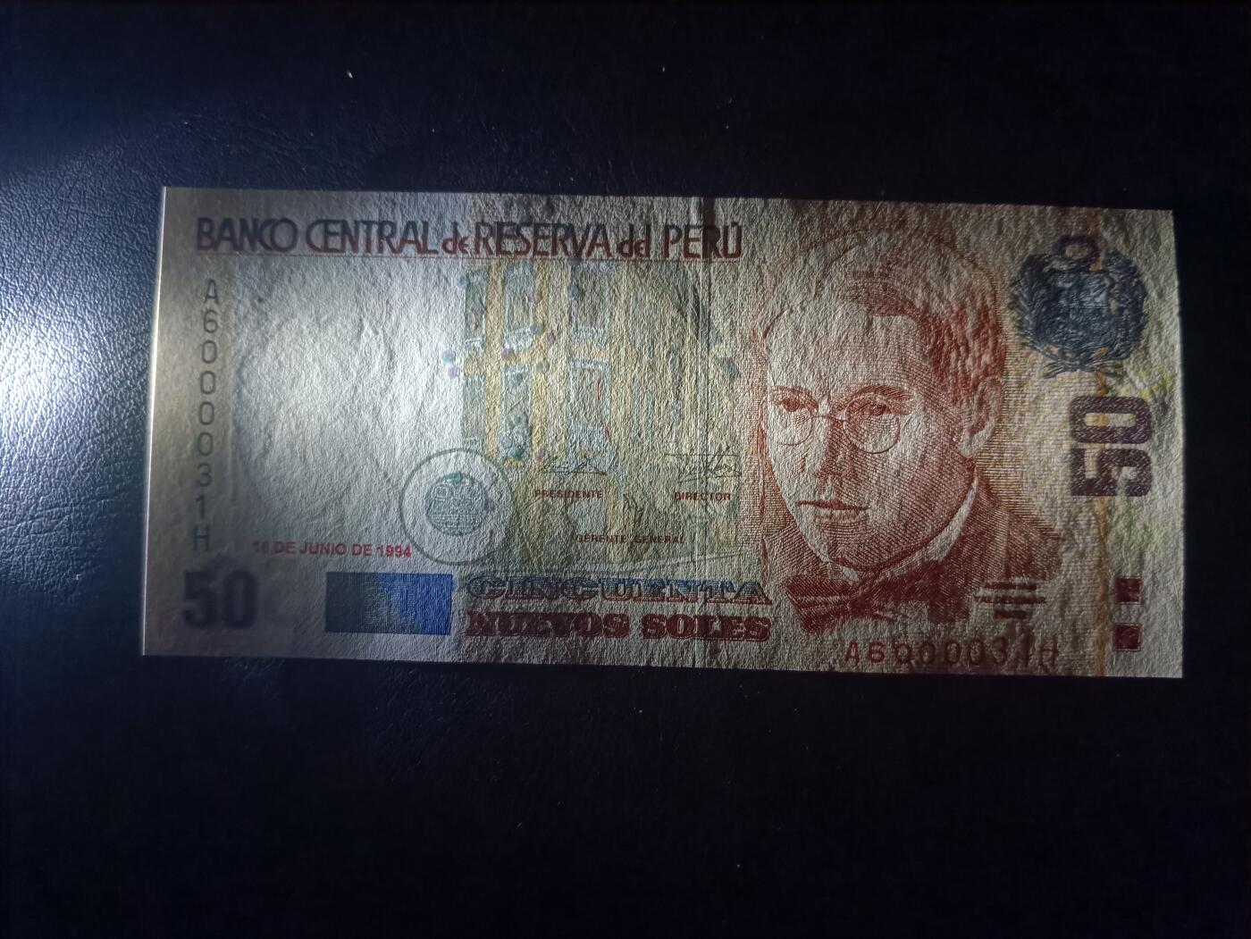 2026首期，总第211期 秘鲁1994年50新索尔UNC微潮狮子身0000无47，稀有早期年份中高面值，作家品托和瓦卡奇纳湖