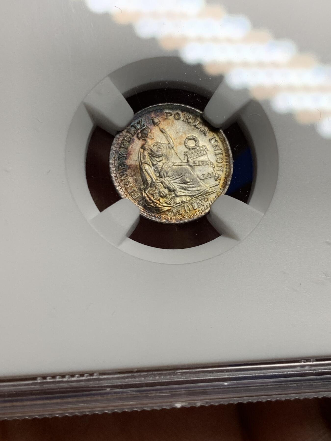 《竞宝斋》第452场 周日，周一 2场连拍 （全场包邮，欢迎送拍） NGC MS64 秘鲁1916年1/2蒂罗娜银币，带一抹极其亮眼的月牙彩，底板有镜面感，不可多得的好状态