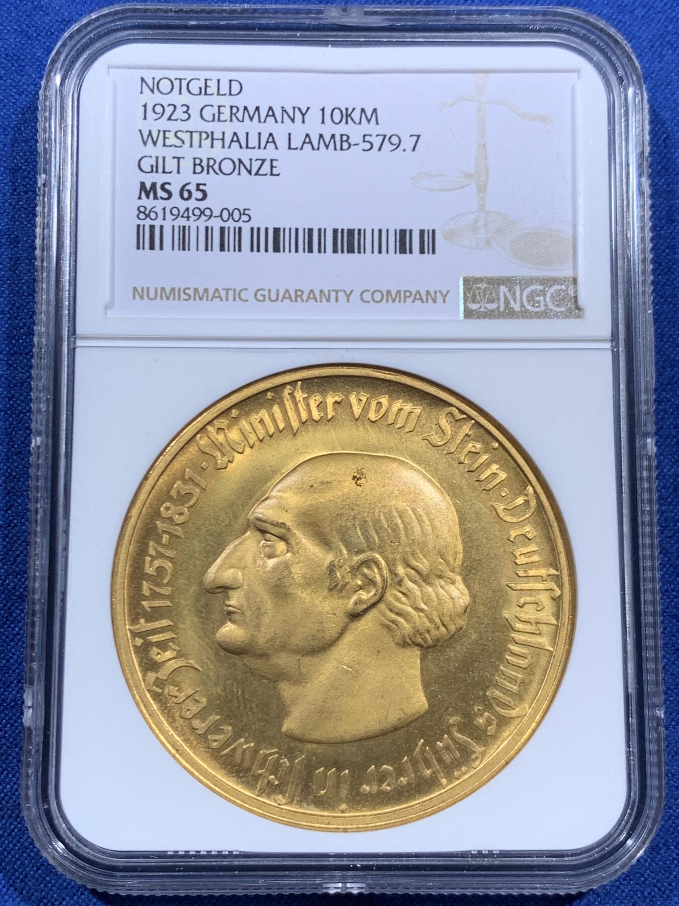 《竞宝斋》第452场 周日，周一 2场连拍 （全场包邮，欢迎送拍） NGC MS65 德国1923年德紧威斯特法伦马币 10000马克镀金铜币，镀层相对完整，漂亮，金光闪闪。
