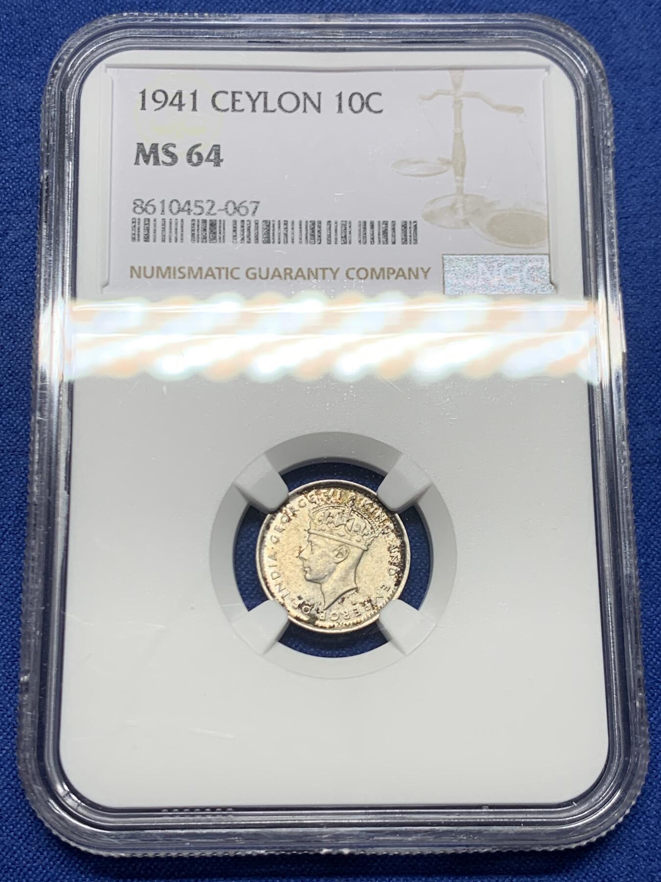 《竞宝斋》第452场 周日，周一 2场连拍 （全场包邮，欢迎送拍） NGC MS64 英属锡兰1941年乔治六世10分银币，BU好品，外面很贵的品种，转光底板犀利