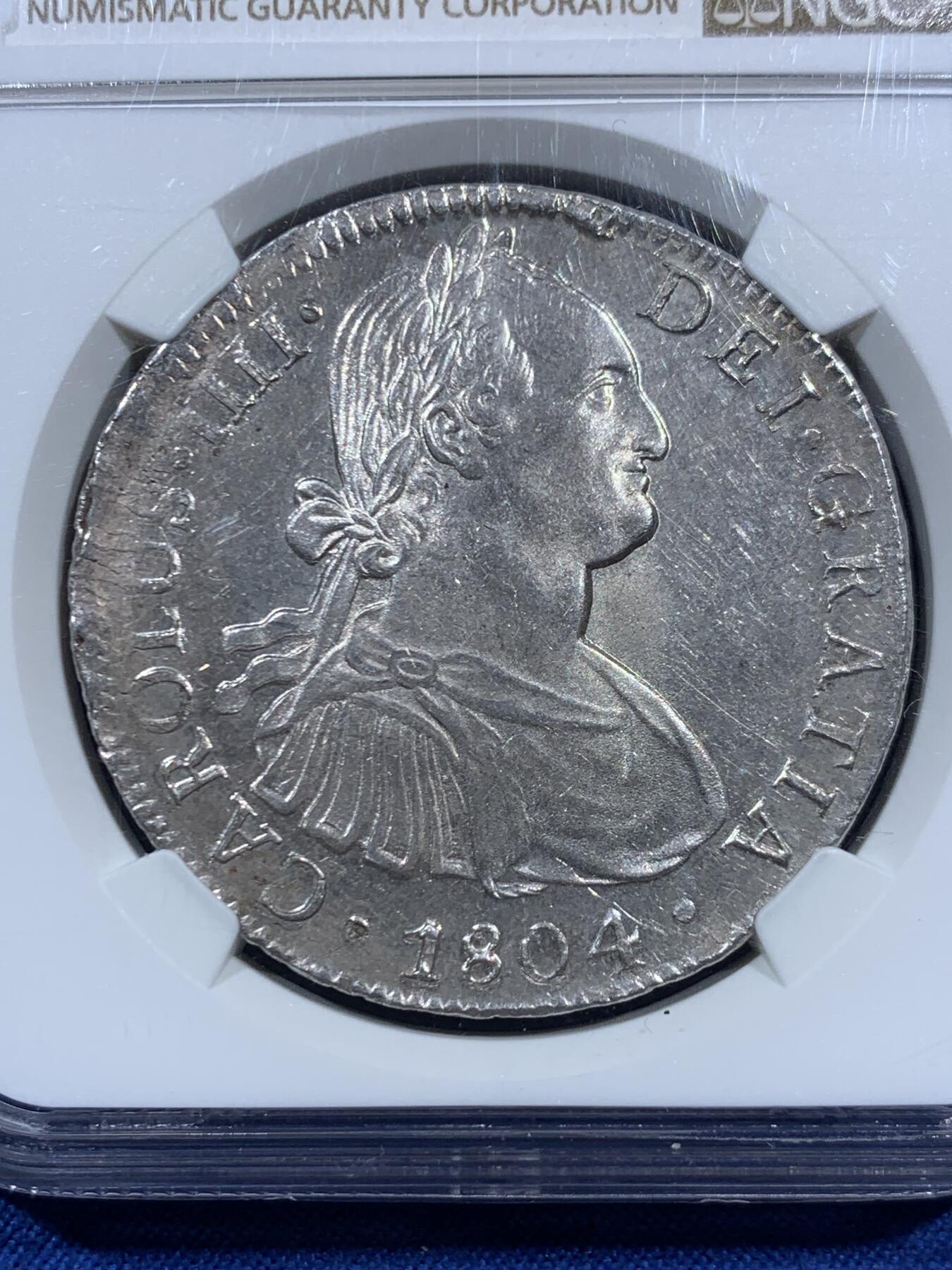 《竞宝斋》第452场 周日，周一 2场连拍 （全场包邮，欢迎送拍） NGC MS62 西属墨西哥1804年卡洛斯四世8里亚尔银币，人像状态非常好，底板略带PL质感。