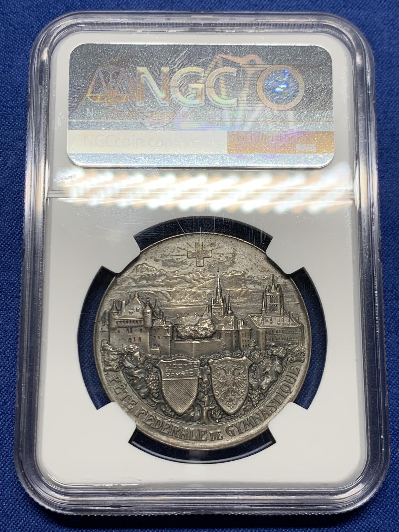 《竞宝斋》第453场 周日，周一 2场连拍 （全场包邮，欢迎送拍） NGC MS62 瑞士洛桑  1909年 城市景观铜章 超燃造型 银章极少见