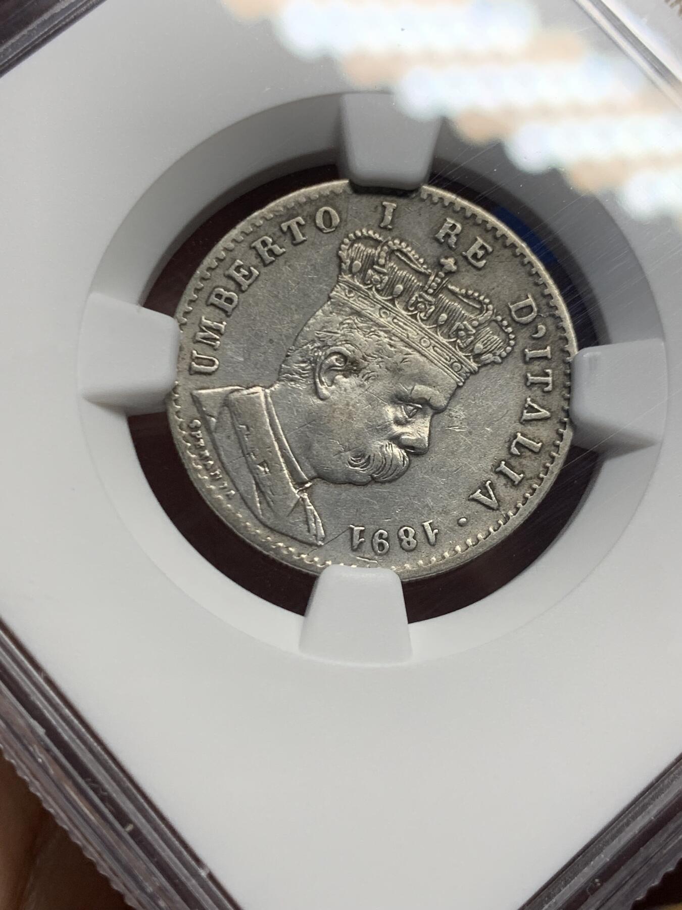 《竞宝斋》第453场 周日，周一 2场连拍 （全场包邮，欢迎送拍） NGC XFD 意属厄立特里亚1891年R厂1里拉银币，少见的意大利殖民地银币，细节不错