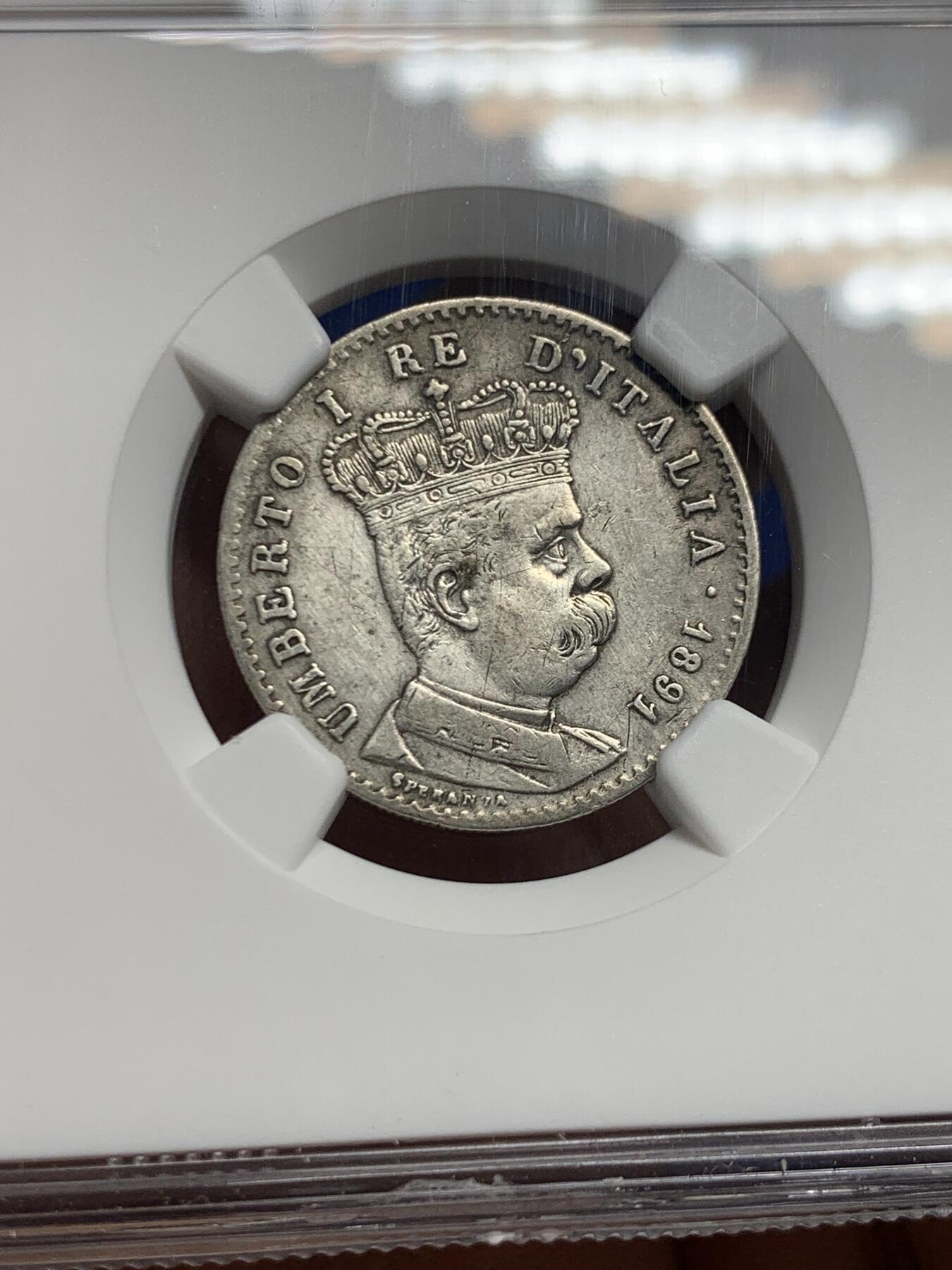 《竞宝斋》第453场 周日，周一 2场连拍 （全场包邮，欢迎送拍） NGC XFD 意属厄立特里亚1891年R厂1里拉银币，少见的意大利殖民地银币，细节不错