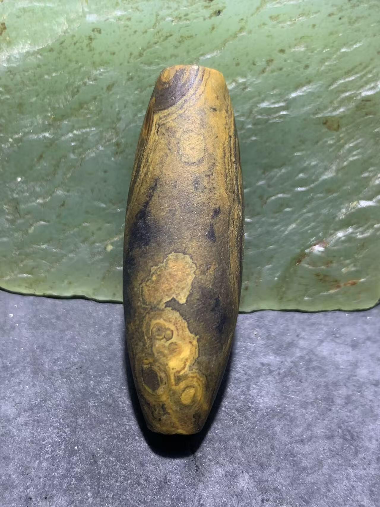 天然精美亚光九眼页岩8字天眼纹天珠一个