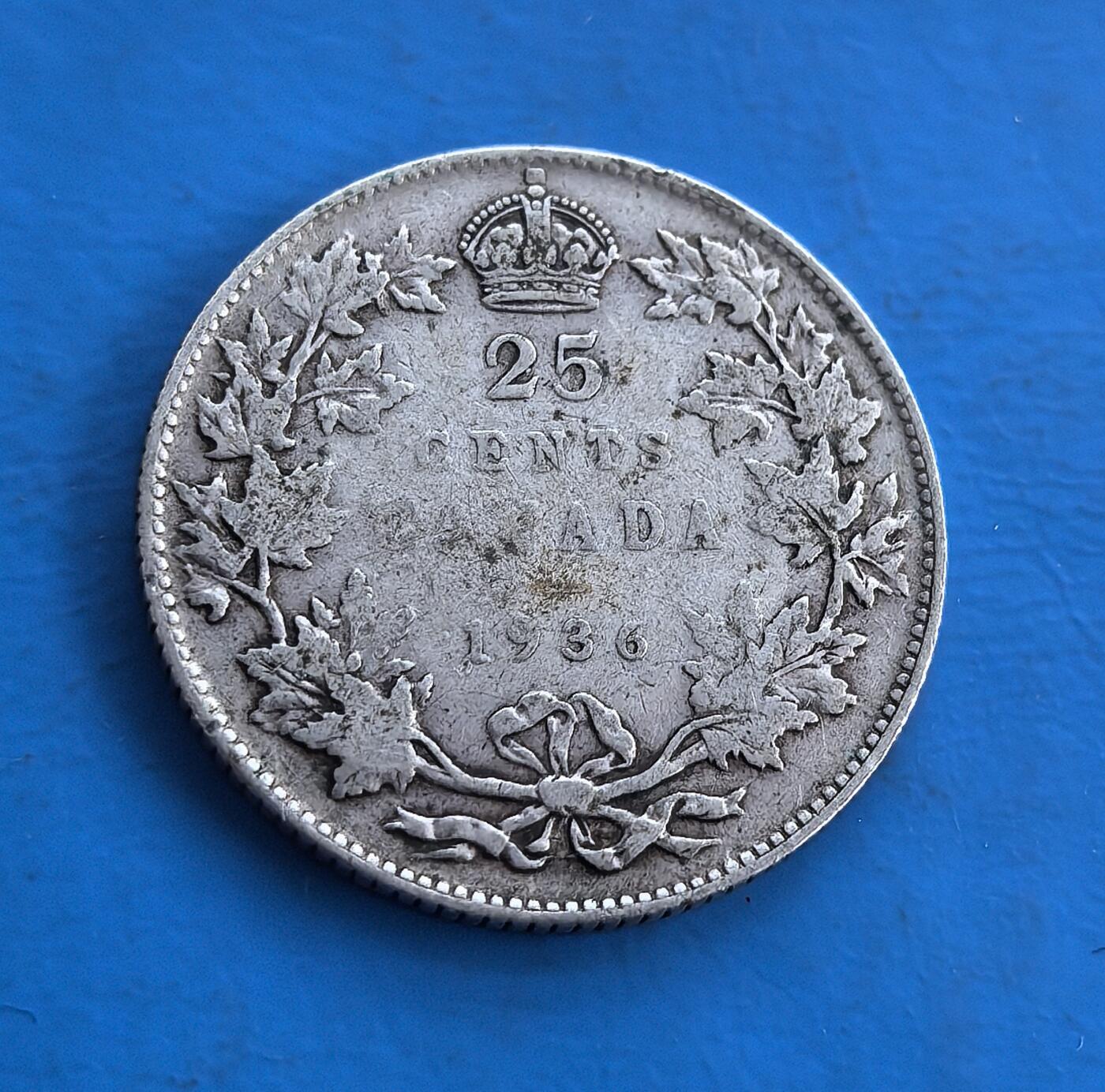 外国优质老铜币高银银币，周六九点倒数截拍，满百包邮，持续收拍 加拿大 1936 年25 分银币，正面为乔治五世像，背面有枫叶、皇冠等经典元素，历史跨度近百年，见证加拿大货币史，银币材质、独特年份与殖民文化印记，是钱币收藏兼具历史与艺术价值的优质标的 。