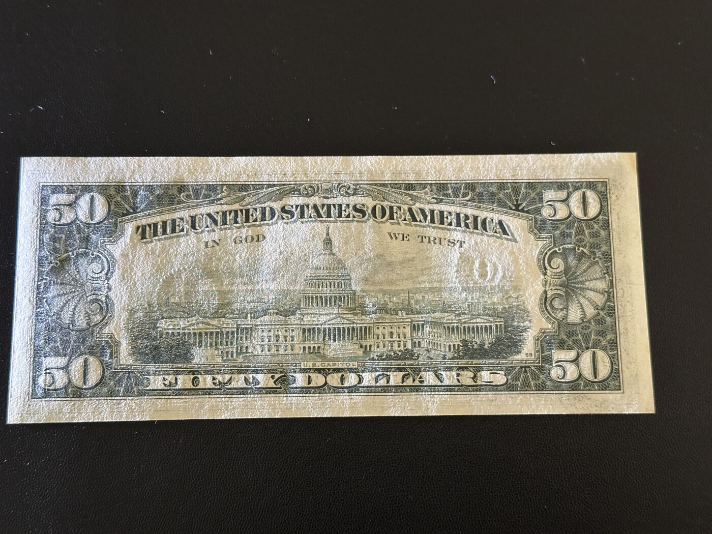 《外钞收藏家》第五百九十八期（2026年新年第一场）（本平台长期征集拍品、欢迎藏友们联系合作） 1977年美国小头版50美元 无折 一个角有黄斑