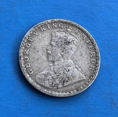 外国优质老铜币高银银币，周六九点倒数截拍，满百包邮，持续收拍 - 英属印度1914 年 2 安那银币，正面乔治五世 “国王 - 皇帝” 像，背面花卉纹环饰 “TWO ANNAS INDIA 1914” 及印度文。银质见证英殖民统治，设计融合英伦君主与印度装饰，铸于一战前夕，属殖民货币稀有标本。承载跨文化统治脉络，为研究英印关系、帝国货币史的独特藏品，藏殖民时代交融印记 。