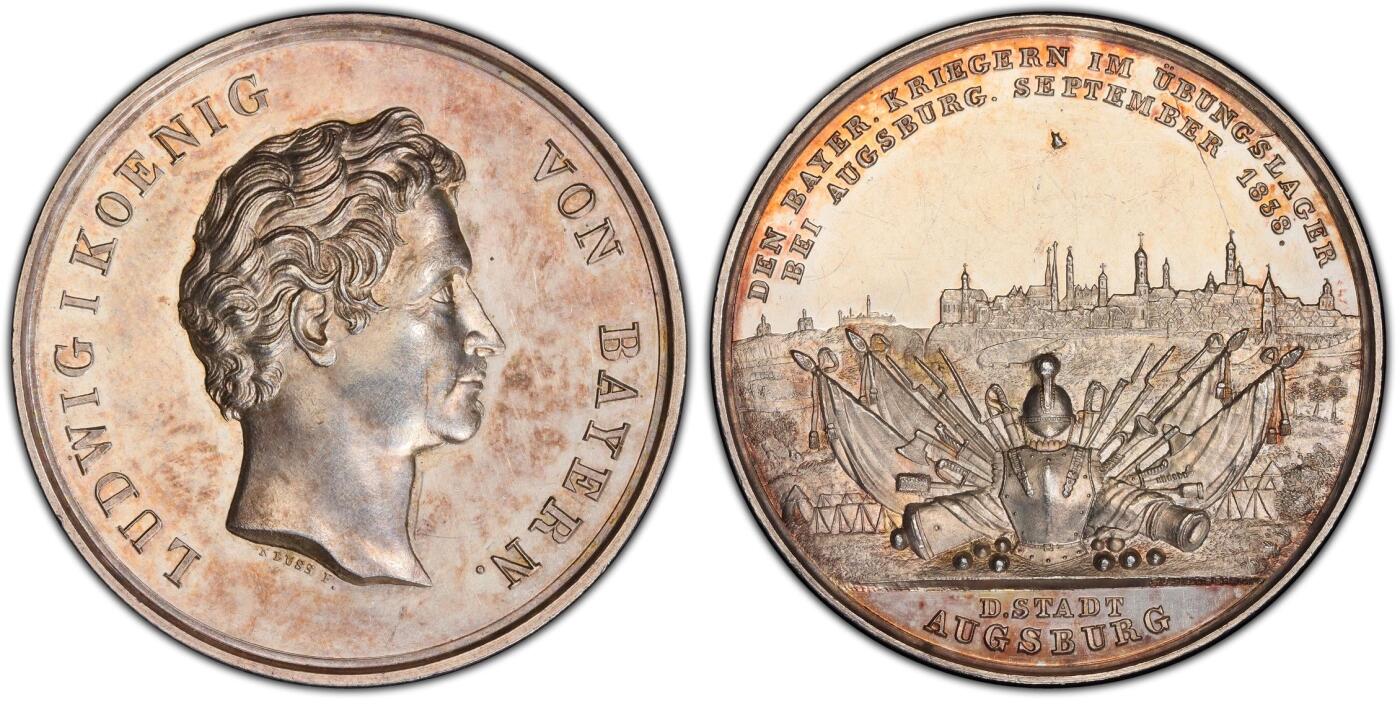 万国钱币拍卖第058期（万国新年大拍） PCGS SP61 1838年德国巴伐利亚路德维希一世奥格斯堡练兵营纪念景观大银章 罕见品种 超高浮雕 正面：拜仁国王路德维希头像 背面：奥格斯堡城市景观，城外原野景观。军营帐篷，各类武器，刀剑枪炮斧，盔甲大炮炮弹。 背面中央镶嵌了一块钴金属 仿佛天外来客 设计巧思 应该是唯一一个使用镶嵌工艺的老银章 亚军分自藏状态合格 高分难遇的品种 