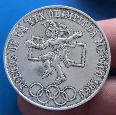 外国优质老铜币高银银币，周六九点倒数截拍，满百包邮，持续收拍 - 墨西哥1968 年奥运25比索银币。22.5克纯银价275元正面阿兹特克舞者配奥运五环，背面经典鹰蛇国徽，融合古文明与奥运精神。含银 0.720 ，币面刻画细腻，承载墨西哥文化底蕴，是奥运纪念币中展现美洲古文明的独特藏品，历史与艺术价值兼具