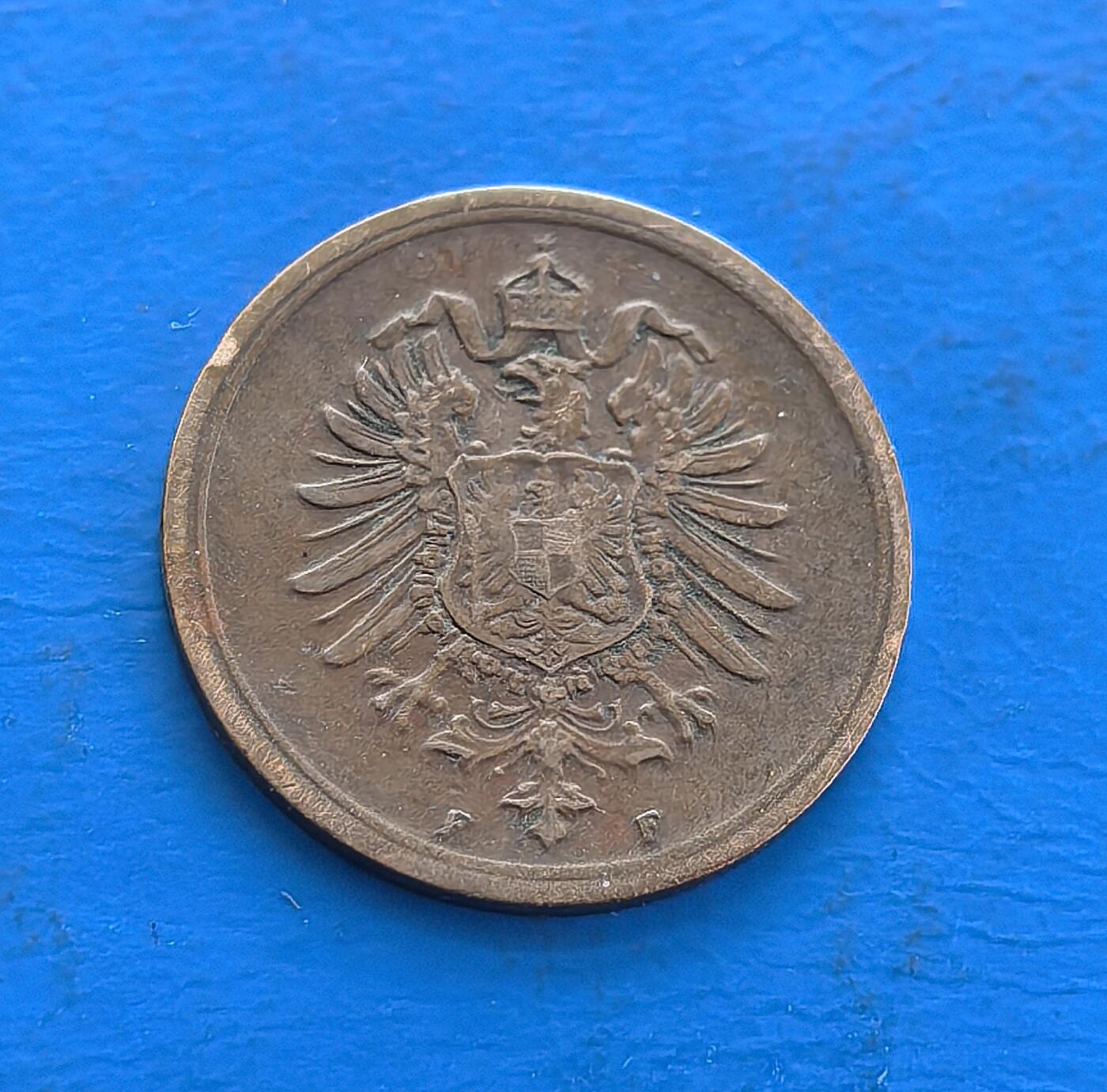 外国优质老铜币高银银币，周六九点倒数截拍，满百包邮，持续收拍 德意志帝国1876 年 1 芬尼铜币F版，铸于威廉一世时期、帝国初创阶段。正面 “DEUTSCHES REICH” 与面值，背面帝国鹰徽彰显统一权威。铜质包浆载百年痕迹，见证德国近代货币体系发端，属欧洲古典币标本，解码帝国初创史，收藏兼具历史厚重与德意志统一符号意趣 。