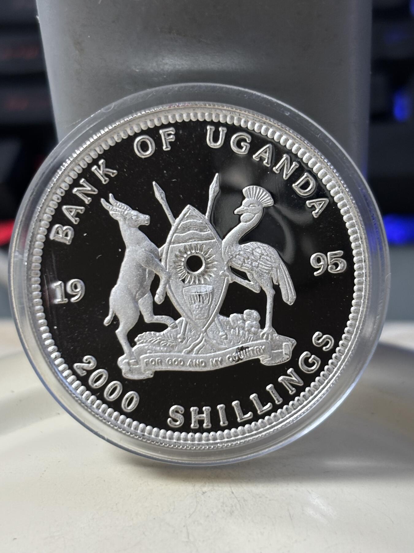 第186期拍卖 乌干达1995年十二生肖猪年彩色纪念银币有丝痕，925银，重20克，银价333