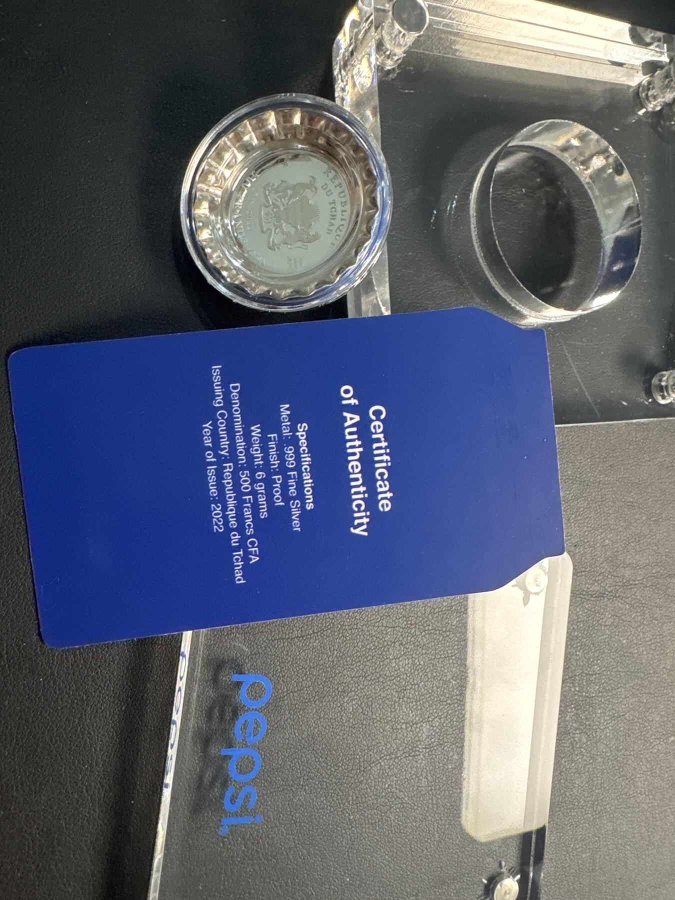 ❤️【币观天下】❤️ 第337期钱币拍卖- 2026.1.2周五晚上6点半场-长期征集拍品 2022年乍得发行百事可乐瓶盖彩色精制银币 盒证齐全