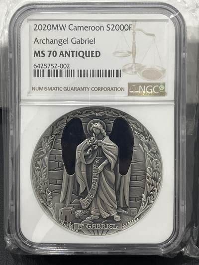 ❤️【币观天下】❤️ 第337期钱币拍卖- 2026.1.2周五晚上6点半场-长期征集拍品 - 喀麦隆天使系列首枚天使加百列镶嵌玻璃2盎司仿古银币，盒证齐全，ngc70