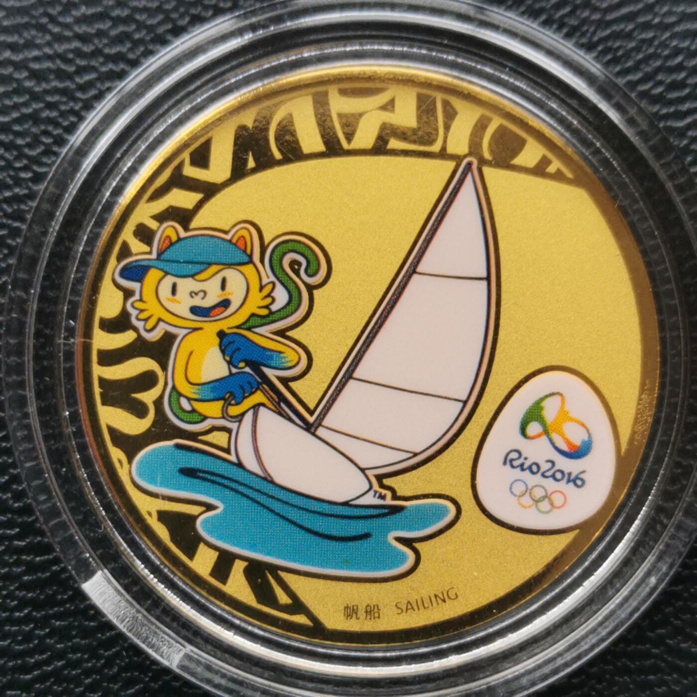 综合藏品场10秒自动快拍，喜欢提前出价！ 帆船.2016巴西里约奥运会彩色金章.帆船.（0.1克金）品相全新塑封包装.直径28MM.