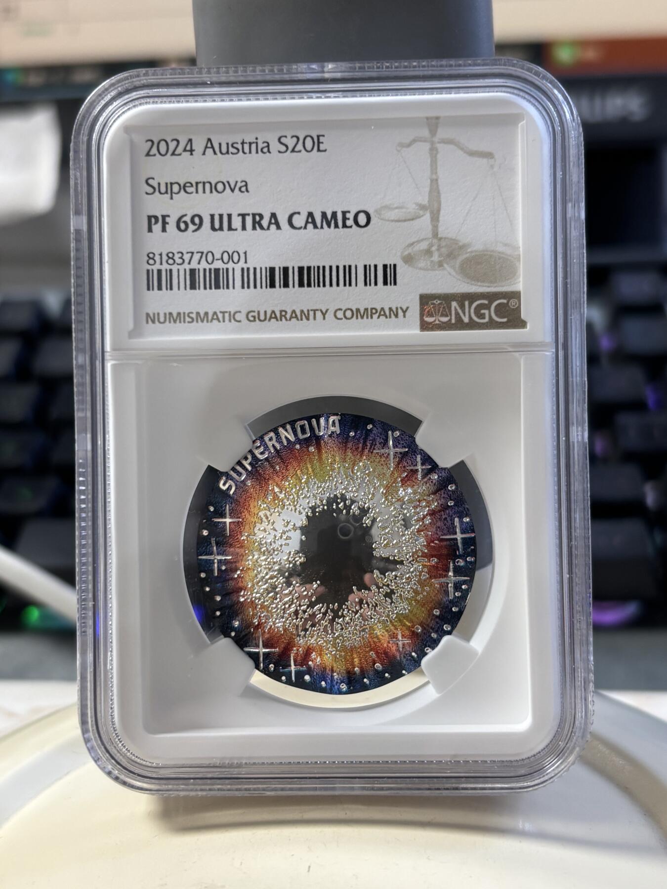 第186期拍卖 获奖币奥地利2024年宇宙之美系列超新星凹凸面22.42克彩色纪念银币NGC-PF69，925银，发行30000枚