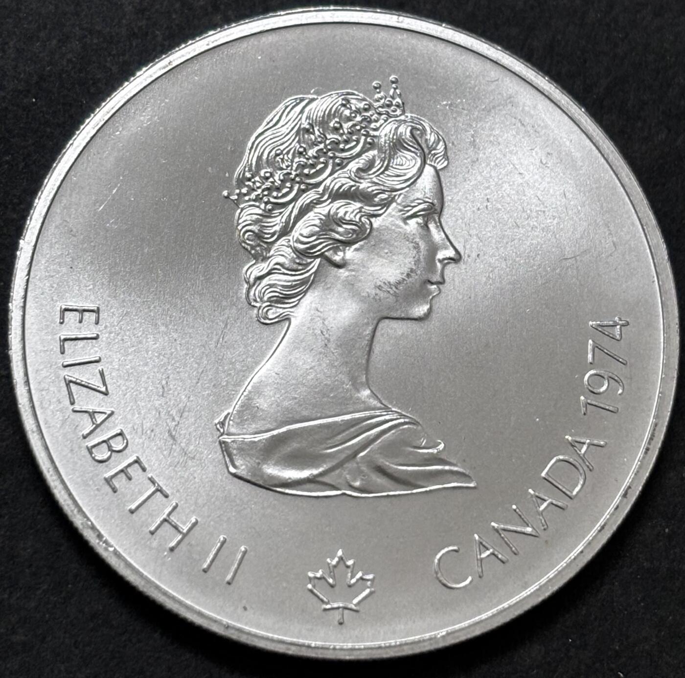 文馨钱币收藏 迎新纳福2026新年第一场（第 287 场）金银老铜币拍卖 原光品相 1974 年加拿大蒙特利亚第 21 届夏季奥林匹克运动会吊环系列赛 5 元纪念大银币，24.3 克 925 高银，品相可评级