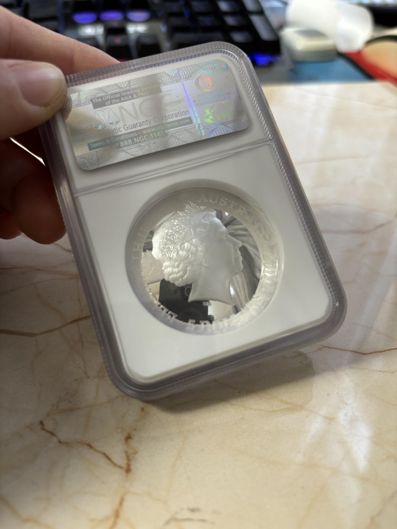 第186期拍卖 澳大利亚2014年南天星空系列3猎户座凹凸纪念1盎司彩色银币NGC-PF69，999银，发行10000枚