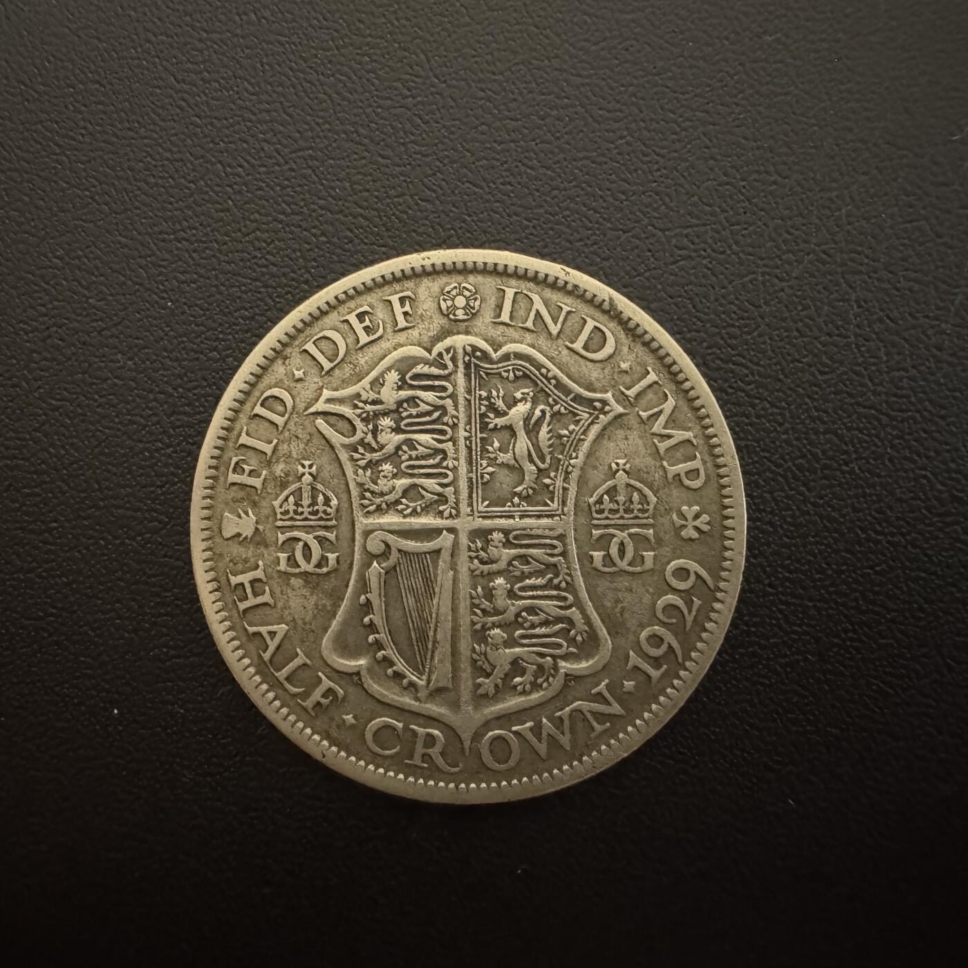 【铜匠收藏】★第135加场★客户代拍 银币场。不寄存，150包邮。不满150元，支付5元运费。《接受代拍 代送NGC评级》 英国1929年乔五半克朗银币 14.14g 50%银