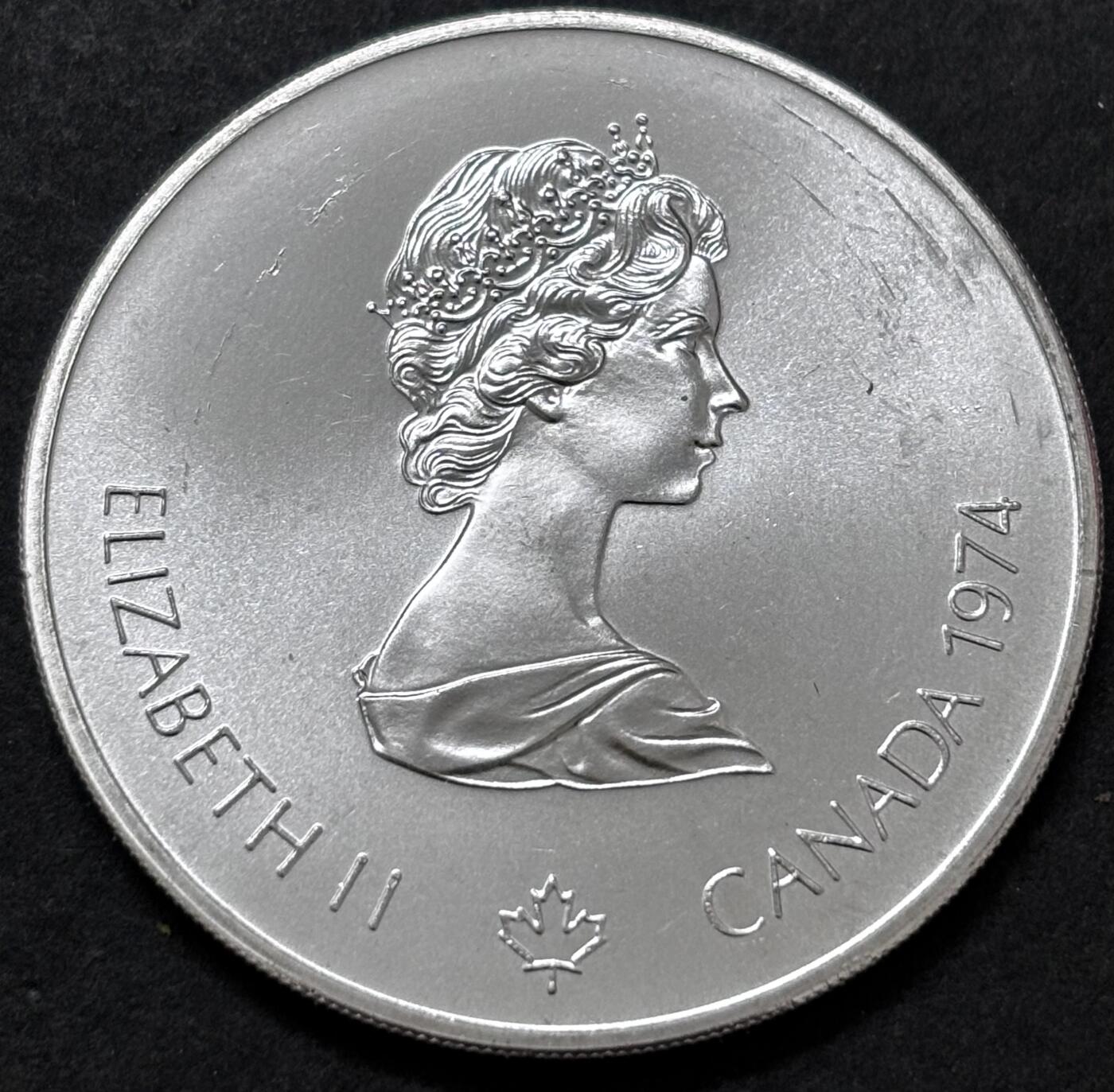 文馨钱币收藏 迎新纳福2026新年第一场（第 287 场）金银老铜币拍卖 原光品相 1974 年加拿大蒙特利亚第 21 届夏季奥林匹克运动会吊环系列赛 5 元纪念大银币，24.3 克 925 高银，品相可评级