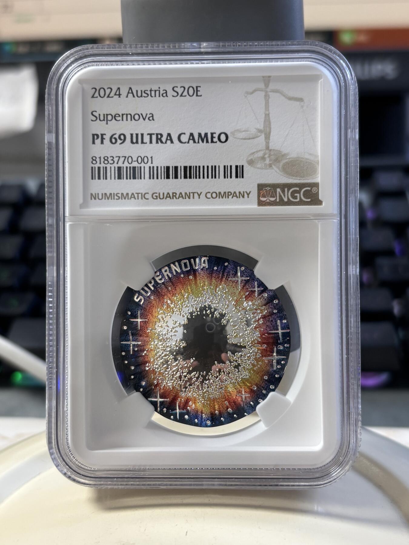 第186期拍卖 获奖币奥地利2024年宇宙之美系列超新星凹凸面22.42克彩色纪念银币NGC-PF69，925银，发行30000枚