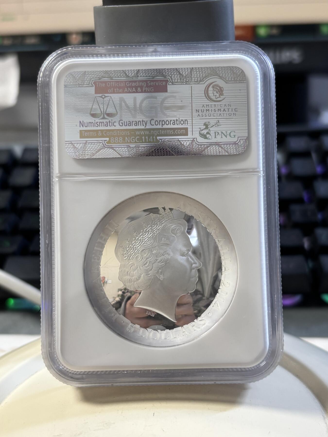 第186期拍卖 澳大利亚2014年南天星空系列3猎户座凹凸纪念1盎司彩色银币NGC-PF69，999银，发行10000枚