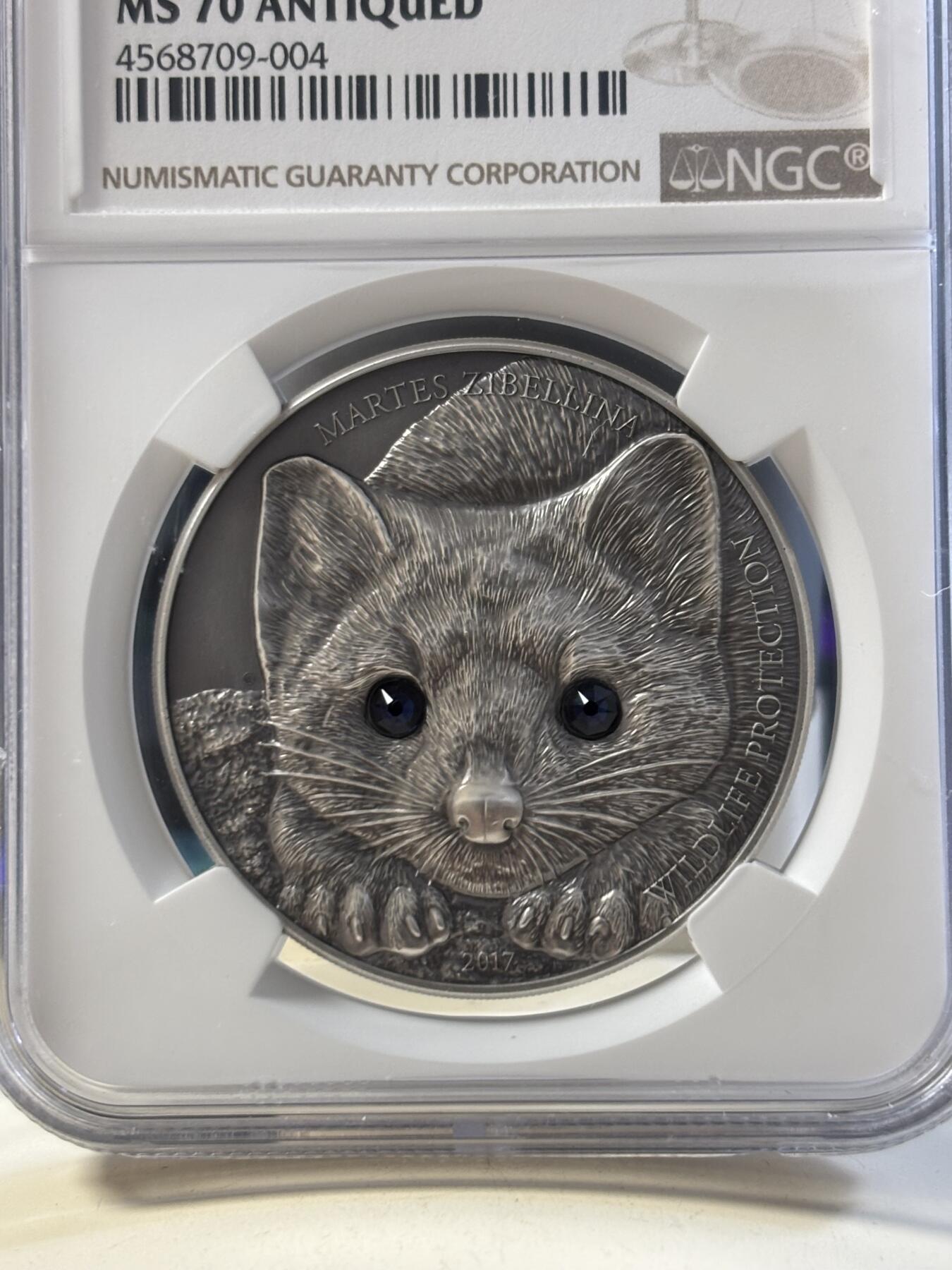 第186期拍卖 蒙古2017年草原动物系列紫貂仿古镶嵌水晶纪念银币NGC-MS70,1盎司。999银，发行2500枚