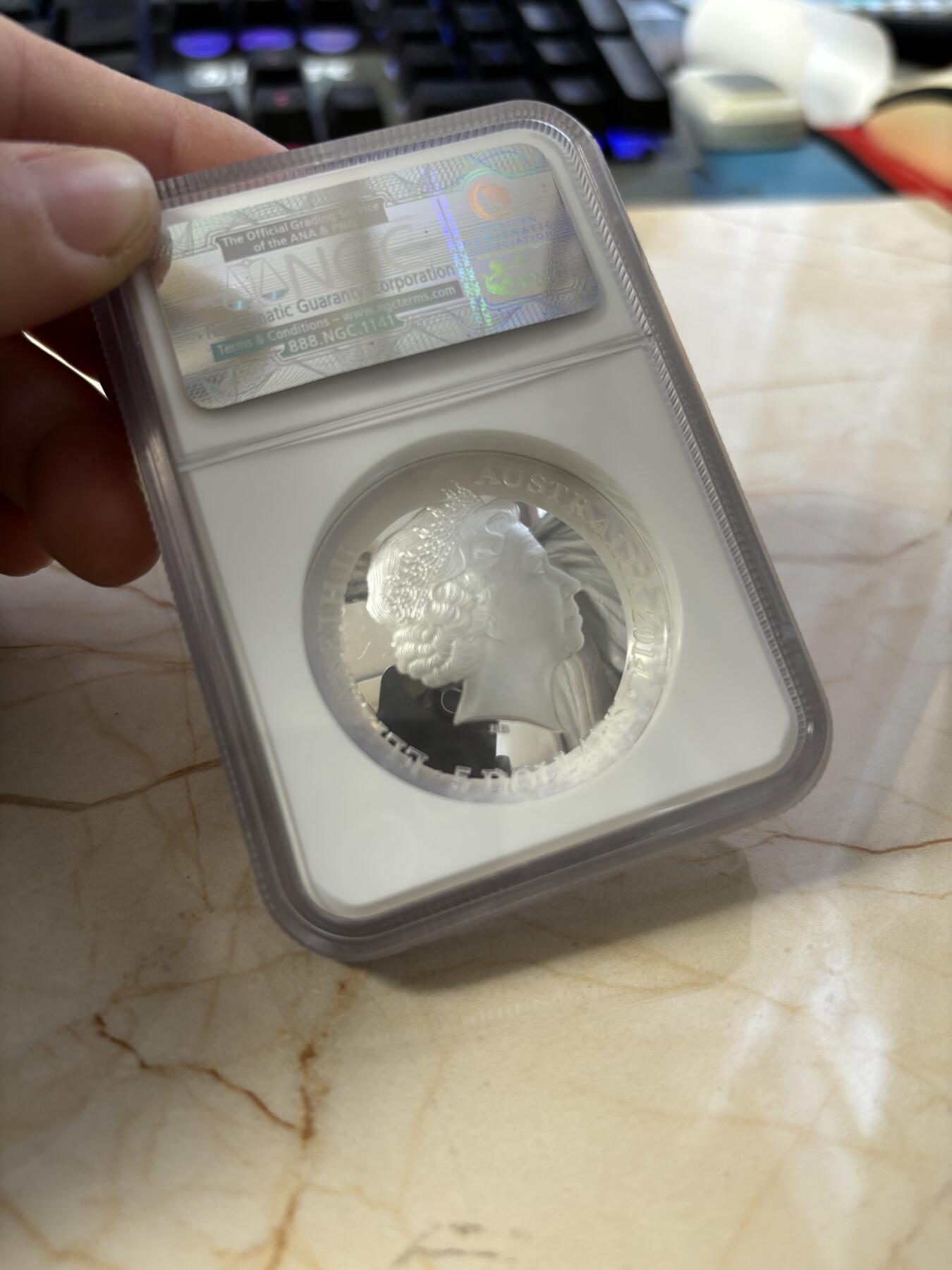 第186期拍卖 澳大利亚2014年南天星空系列3猎户座凹凸纪念1盎司彩色银币NGC-PF69，999银，发行10000枚