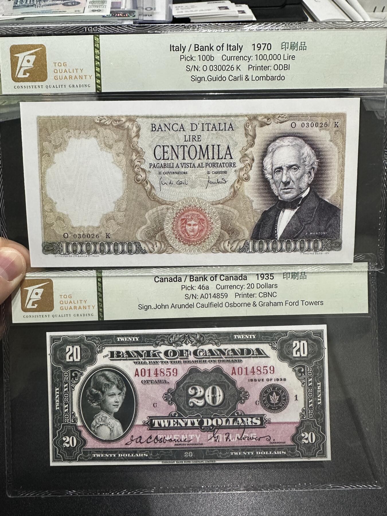 《外钞收藏家》第五百九十九期（畅拍场）（本平台长期征集拍品、欢迎藏友们联系合作） 意大利曼佐尼和加拿大20加元2张印刷印 TQG评级