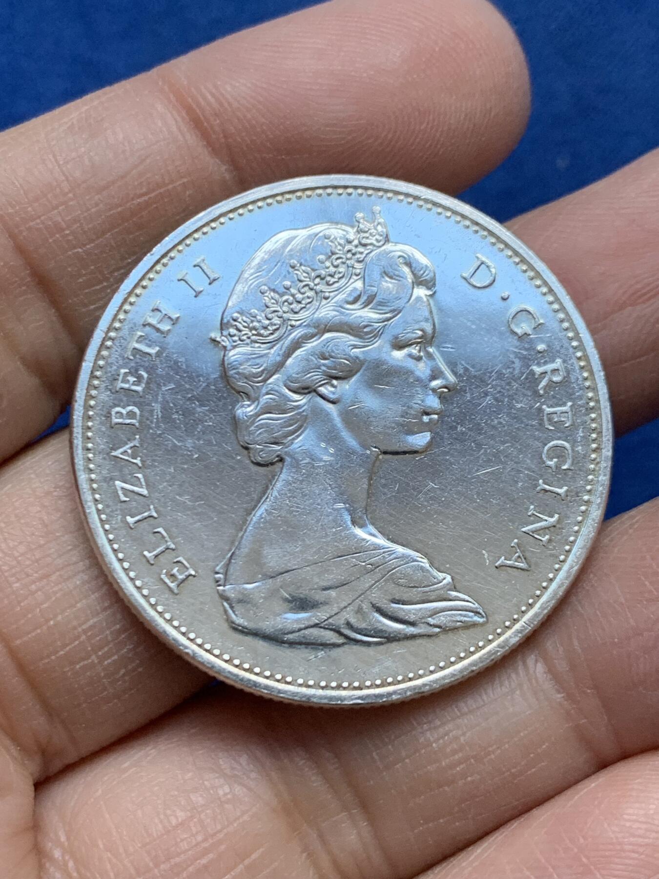 《竞宝斋》第454场 周日，周一 2场连拍 （全场包邮，欢迎送拍） 加拿大1965年划船银币 800银 23.23克