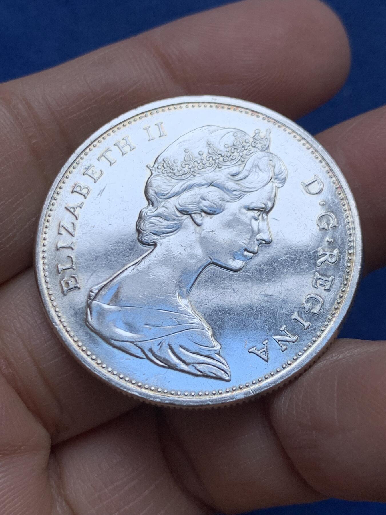 《竞宝斋》第454场 周日，周一 2场连拍 （全场包邮，欢迎送拍） 加拿大1965年划船银币 800银 23.23克