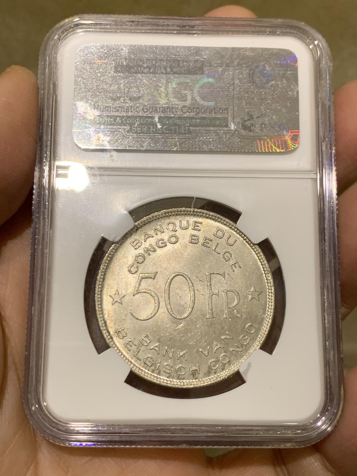 《竞宝斋》第454场 周日，周一 2场连拍 （全场包邮，欢迎送拍） NGC MS63 比属刚果1944年大象50法郎大银币，非洲名誉品，同分书价500美金。淡彩好状态，NGC老盒保障。殖民地经典主币，非洲象威武雄壮