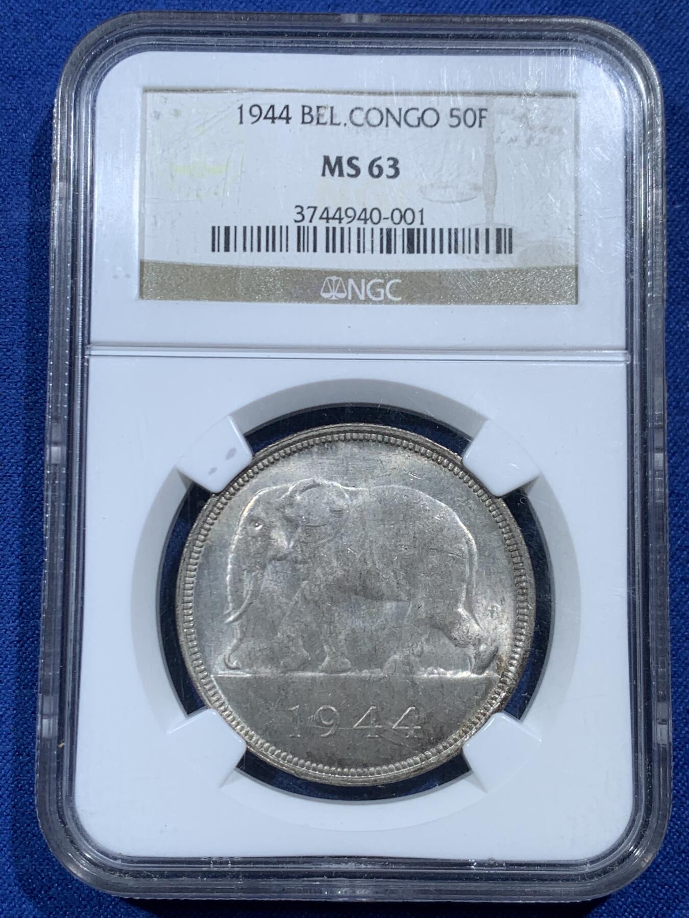 《竞宝斋》第454场 周日，周一 2场连拍 （全场包邮，欢迎送拍） NGC MS63 比属刚果1944年大象50法郎大银币，非洲名誉品，同分书价500美金。淡彩好状态，NGC老盒保障。殖民地经典主币，非洲象威武雄壮
