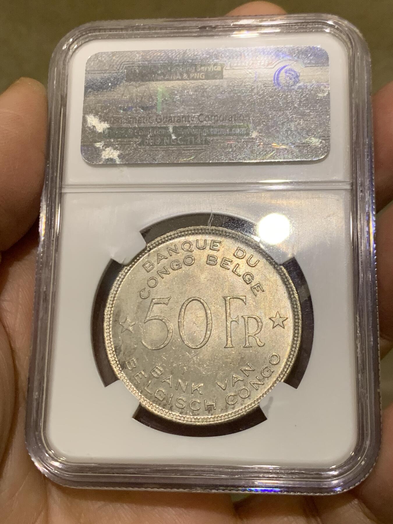 《竞宝斋》第454场 周日，周一 2场连拍 （全场包邮，欢迎送拍） NGC MS63 比属刚果1944年大象50法郎大银币，非洲名誉品，同分书价500美金。淡彩好状态，NGC老盒保障。殖民地经典主币，非洲象威武雄壮