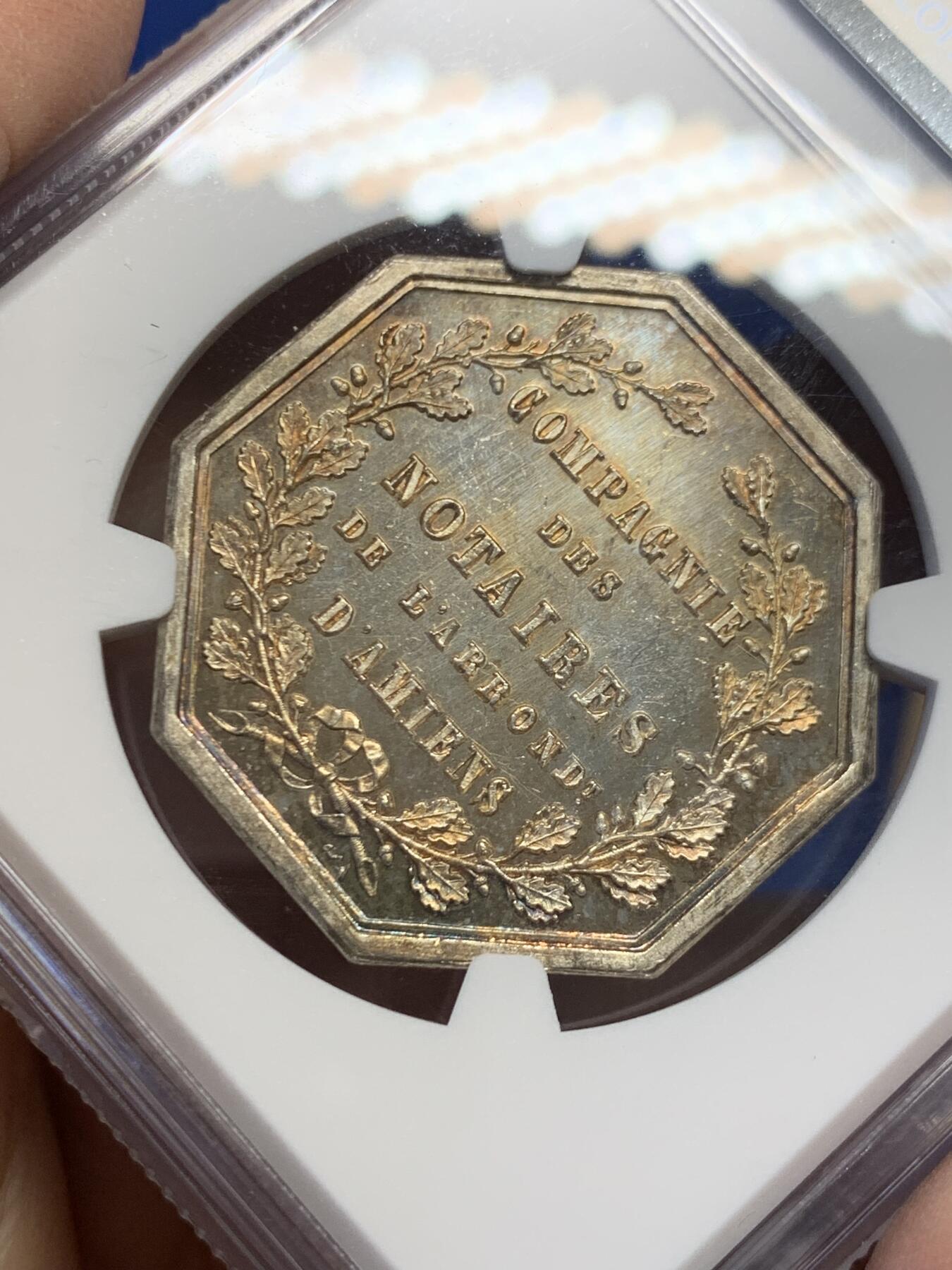 《竞宝斋》第454场 周日，周一 2场连拍 （全场包邮，欢迎送拍） NGC MS64 法国1854年亚眠公证处八角银质代币 PL底板 金色包浆 顶级品相状态