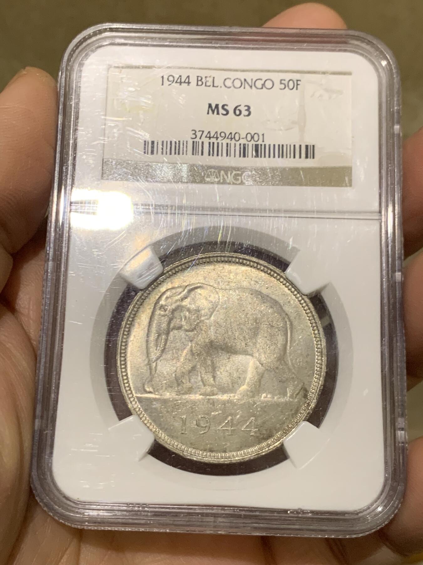 《竞宝斋》第454场 周日，周一 2场连拍 （全场包邮，欢迎送拍） NGC MS63 比属刚果1944年大象50法郎大银币，非洲名誉品，同分书价500美金。淡彩好状态，NGC老盒保障。殖民地经典主币，非洲象威武雄壮
