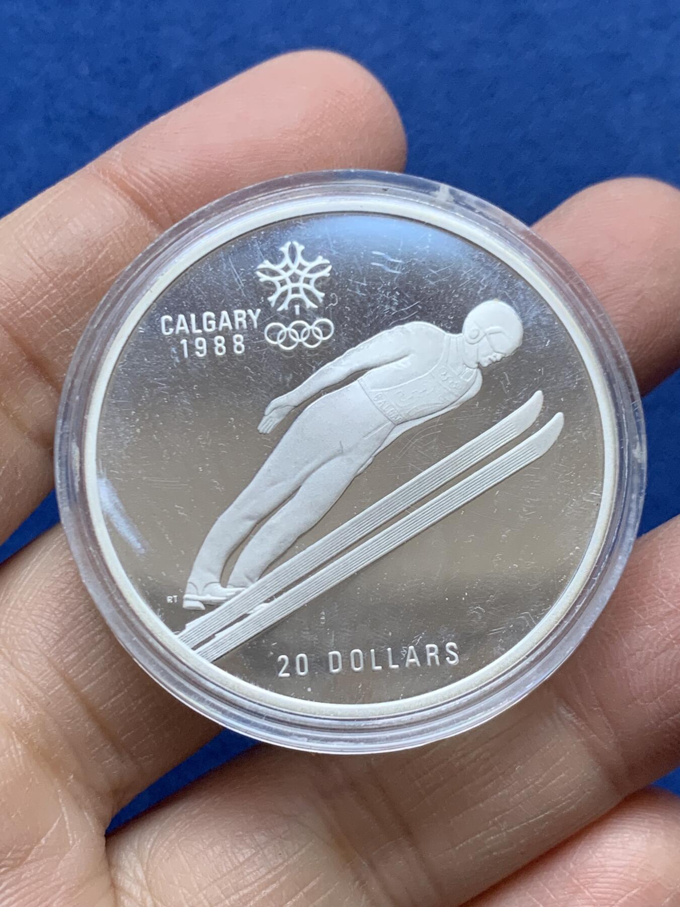 《竞宝斋》第454场 周日，周一 2场连拍 （全场包邮，欢迎送拍） 加拿大1988年卡尔加里冬奥会-跳台滑雪精制大银币 925银 34克