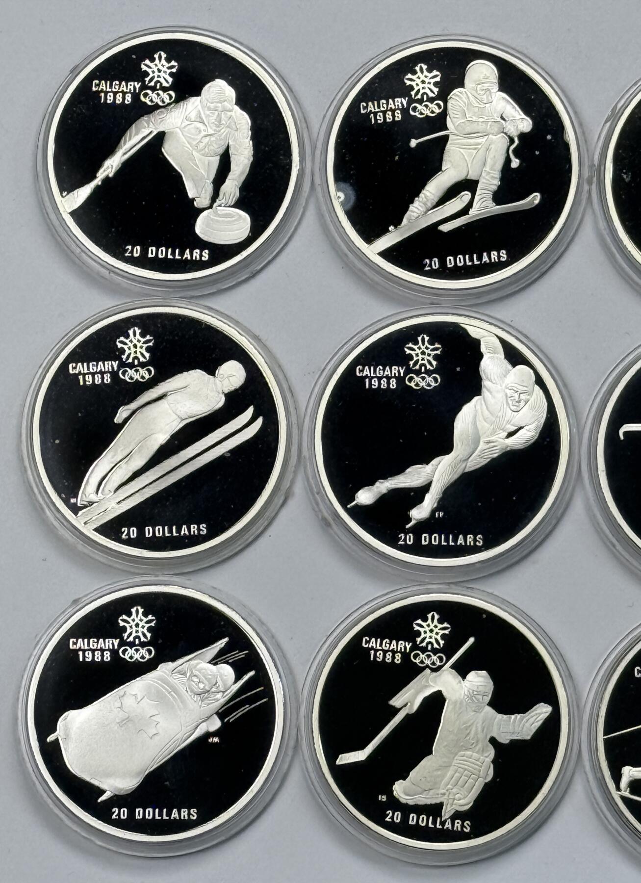 S&S Numismatic世界钱币-拍卖 第118期  加拿大1985-1987年 卡尔加里冬奥会 20加元精制纪念银币10枚全套 34.07克925银/枚，品相如图，塑料外壳有磨损